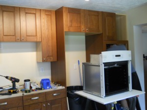 Jim is wiring the wall oven.